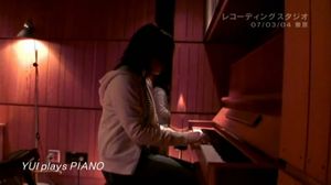 YUI playing piano TYMT.jpg